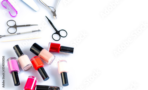 materials for nail care, varnishes and devices on a white table. Manicure at home