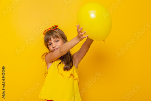 Little girl playing with a balloon © Impact Photography