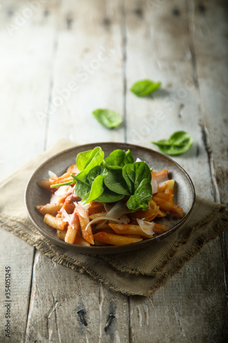 Fototapeta Naklejka Na Ścianę i Meble -  Pasta with tomato sauce and fresh spinach