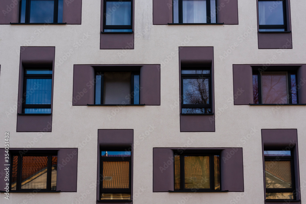Fototapeta premium House facade with lots of windows, abstract house facade
