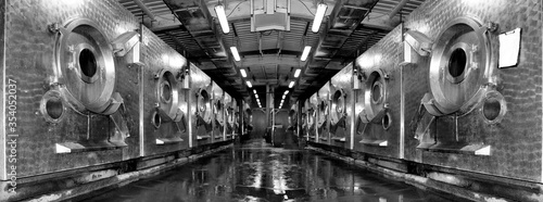 Old and outdated washing machine factory with broken and worn out cars