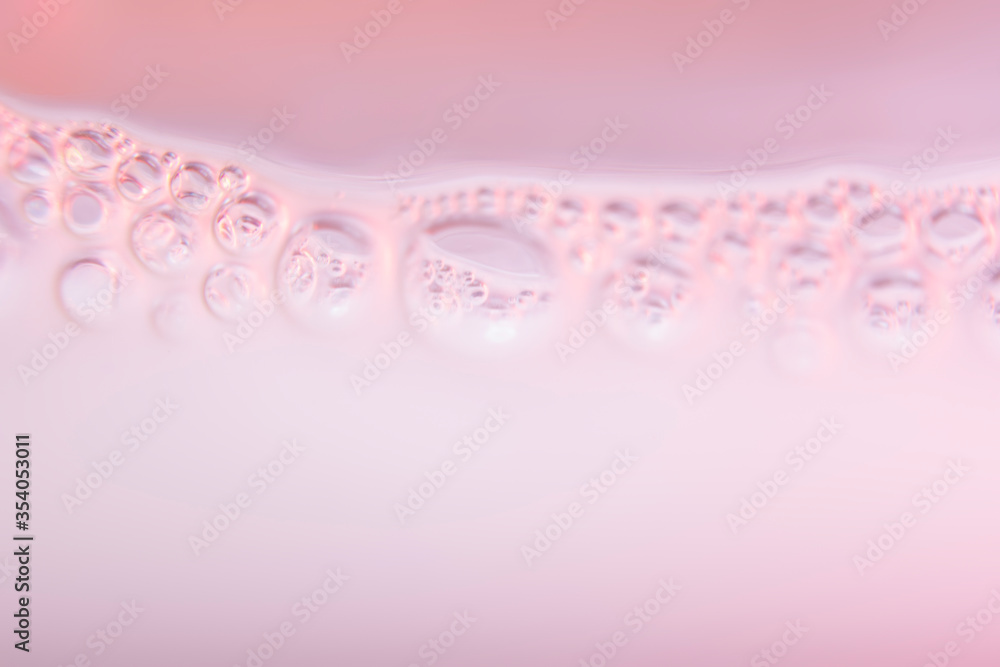 Fototapeta Blurred abstract pink background with bubbles. The concept is summer, soft drinks, freshness. For the backing of a site or mobile application.