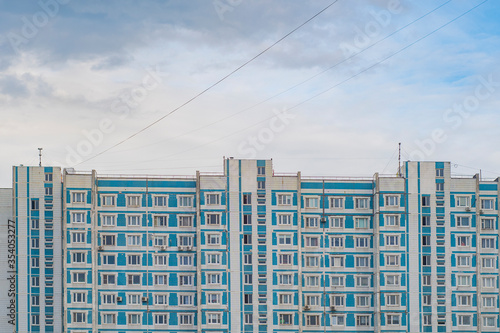 RU, Moscow, 26.05.2020: View of a multi-apartment, multi-storey residential building in white and blue photo