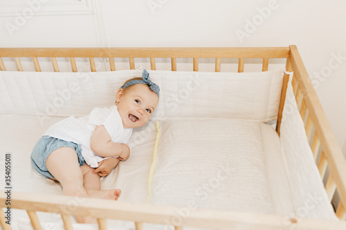 Wallpaper Mural baby girl in her bed, with headband.  Torontodigital.ca