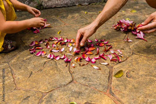 Photography Girls playing wiht petals of flowers in Botanical gardens, Kuala Lumpur, Malaysi