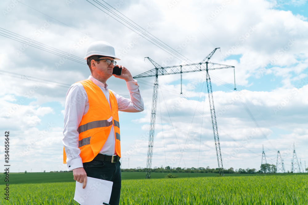 Engineer working near transmission lines. Electrical engineer checks