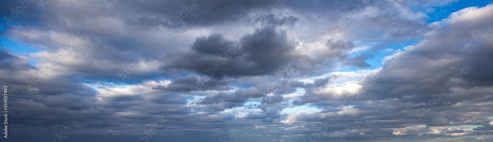 blue sky with white clouds and sun light background