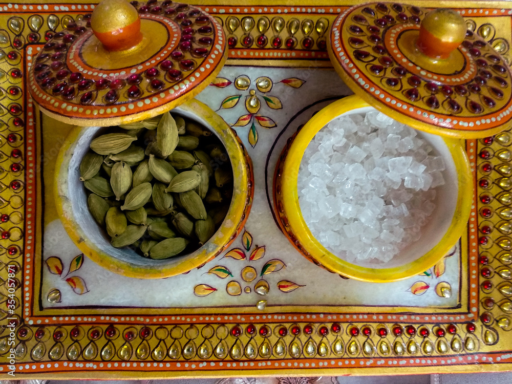 Traditional Handmade Kundan Tray and Bowl containing cardamom and misri (rock sugar) as a mouth freshner. 