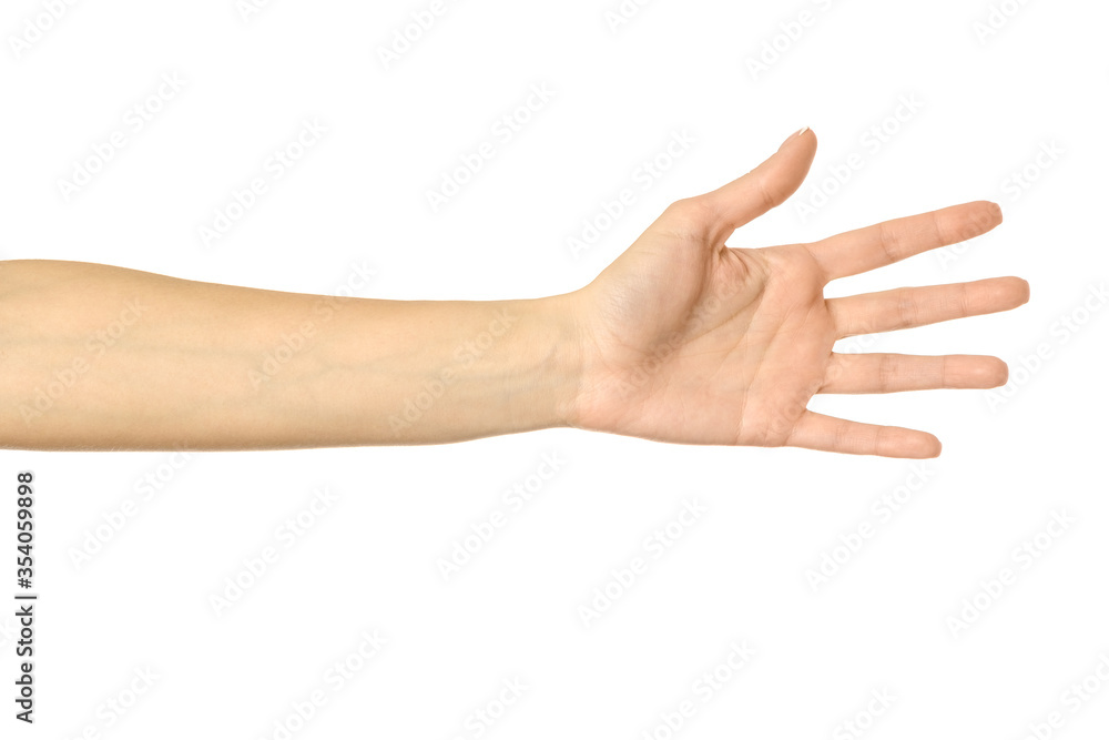 Reaching hand. Woman hand gesturing isolated on white Reaching hand. Woman hand gesturing isolated on white