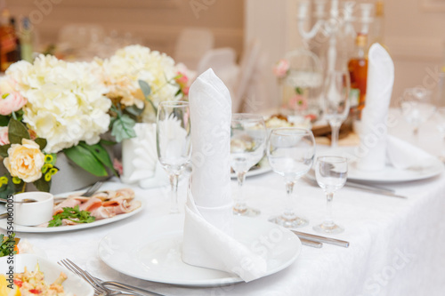 wedding table setting and decorated with flowers 