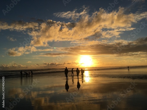 Golden Sunset in a tropical beach With sand, Horse and rock