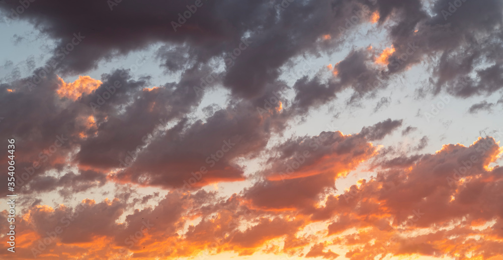 Beautiful bright sunset sky. Dramatic colorful clouds after sunset. Nature backgrounds.Beautiful bright sunset sky. Dramatic colorful clouds after sunset. Nature backgrounds.