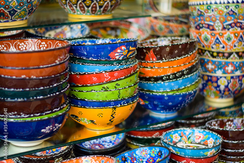 Colorful Glass bowls and saucers kept on display as a souvenir. These artistic hand made designer bowls are used as home decor items