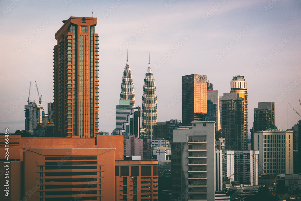 The recognizable skyline of the city  Kuala Lumpur, Malaysia, with Petronas twin towers in the dawn light.