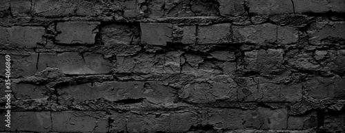 Banner Black brick wall close-up. Rough background.