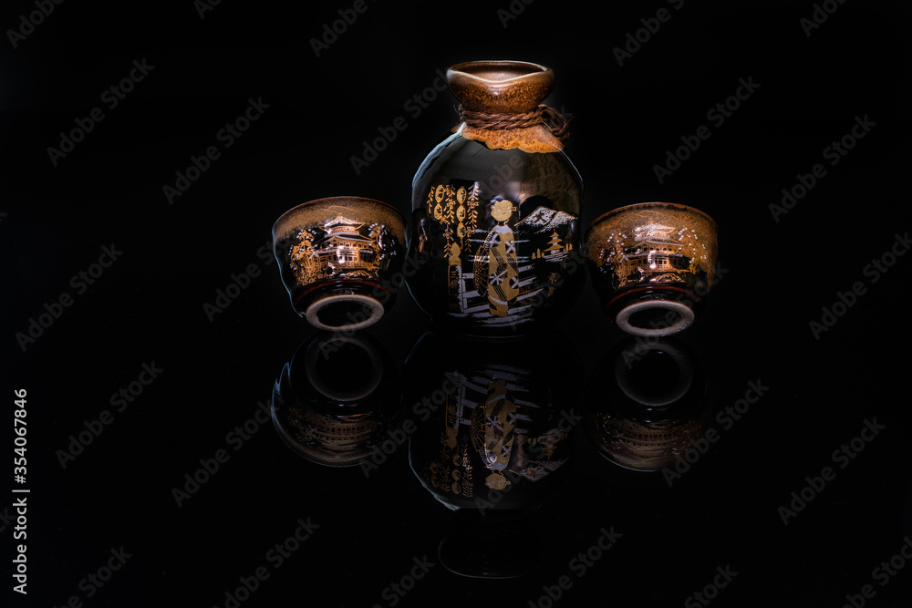 A sake set with two cup and a jug