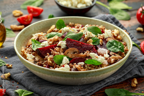 Buckwheat and beetroot salad with mushroom, walnut, spinach and feta cheese. healthy diet food