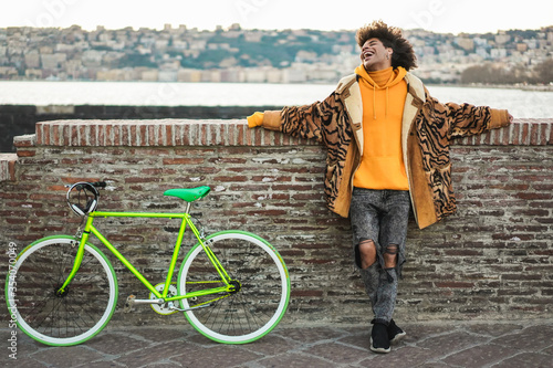 Canvas Print Happy stylish millennial guy having fun outdoor - Young mixed race trendy man ar