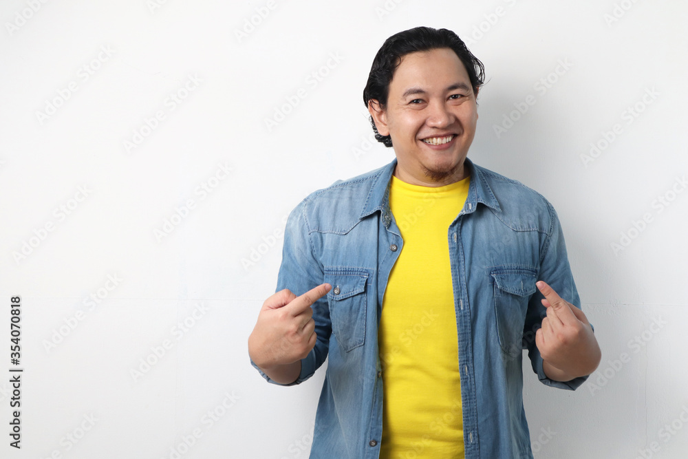 Happy Asian Man Smiling and Pointing Himself Happy Asian Man Smiling and Pointing Himself