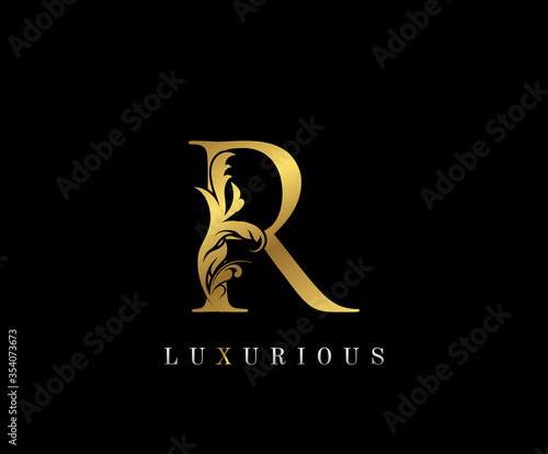 Gold Elegant letter R. Graceful style icon. Calligraphic beautiful logo. Vintage drawn emblem for book design, brand name, wedding card, Restaurant, Boutique, Hotel. photo