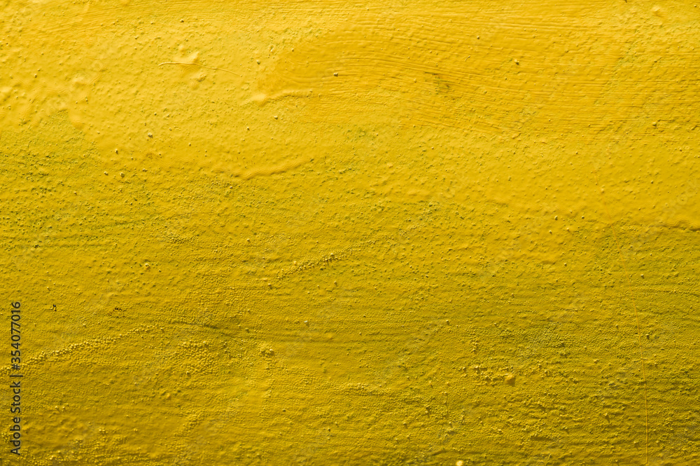 Naklejka premium Yellow background. Texture. Metal painted in yellow.