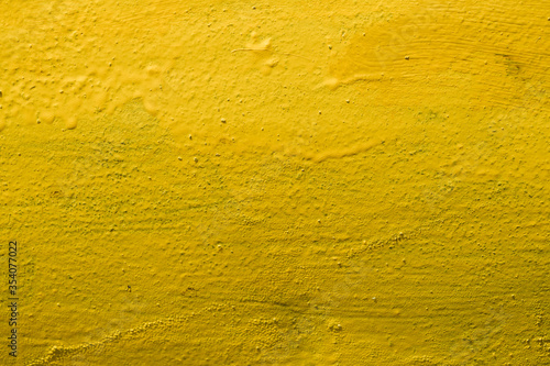 Yellow background. Texture. Metal painted in yellow.