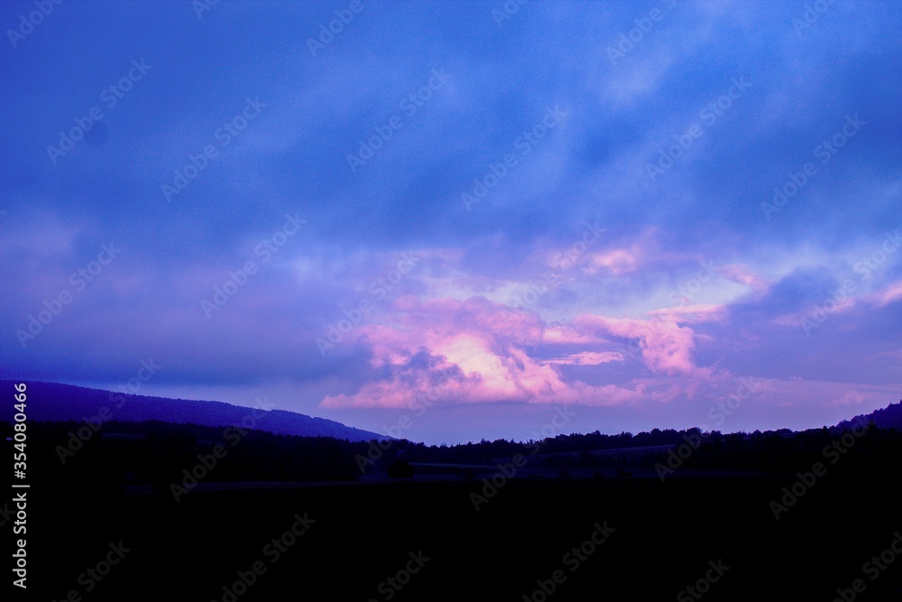 Obraz premium time lapse of clouds at sunset