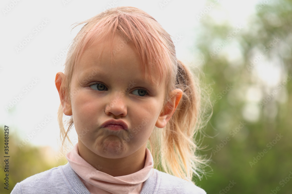 Little cute girl emotions, dissatisfied with something