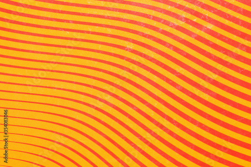 orange sheet of paper with red stripes