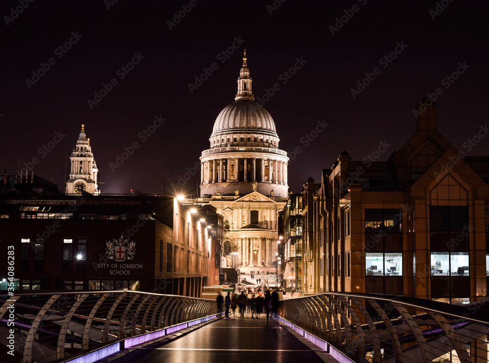 Photo of St Pauls cathedral in London during the night from the bridge