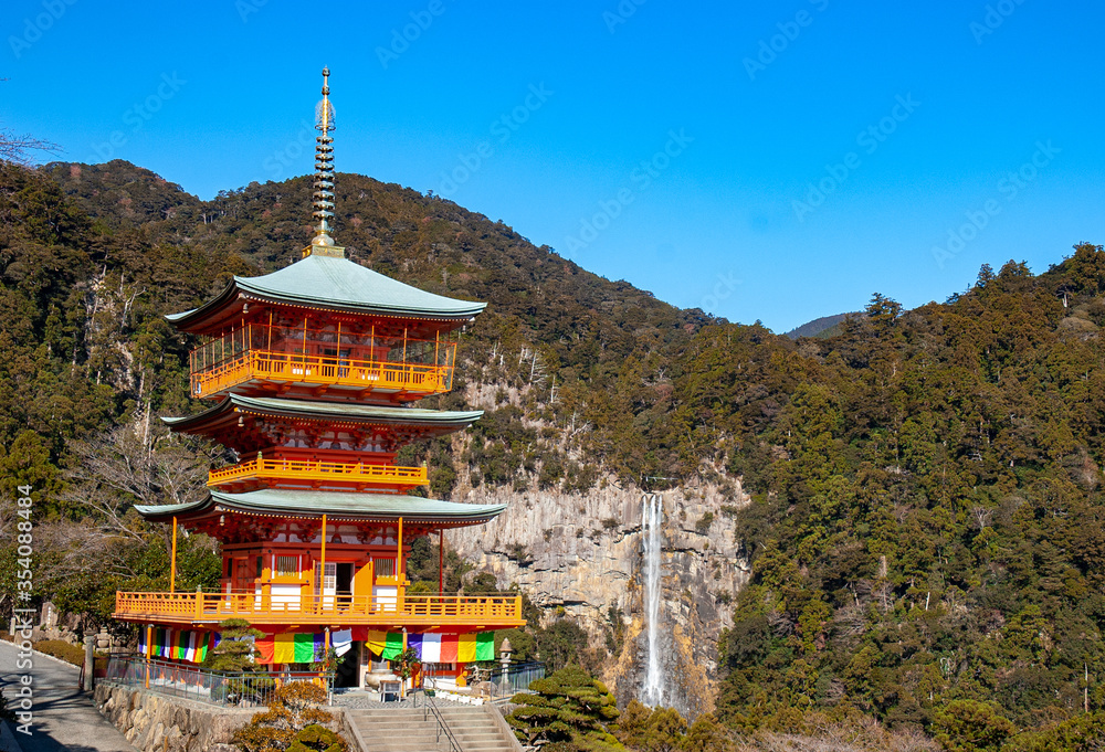Seigantoji temple pagoda and Nachi Falls , which is part of the Sacred Sites and Pilgrimage Routes in the Kii Mountain Range registered in UNESCO in Nachikatsuura, Wakayama, Japan Seigantoji temple pagoda and Nachi Falls , which is part of the Sacred Sites and Pilgrimage Routes in the Kii Mountain Range registered in UNESCO in Nachikatsuura, Wakayama, Japan