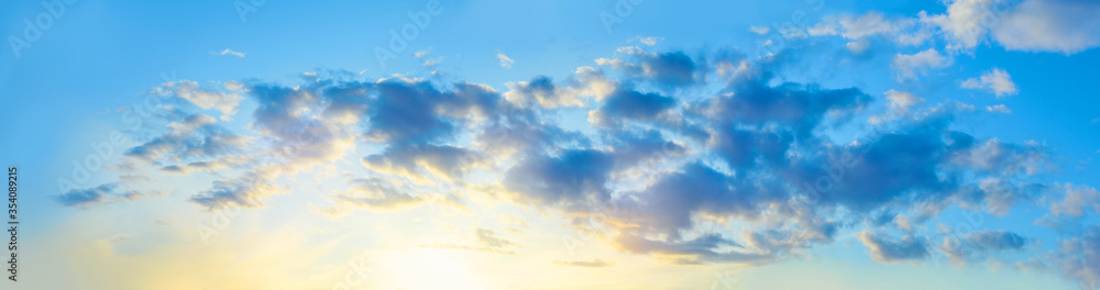Blue sky with clouds, sunset background