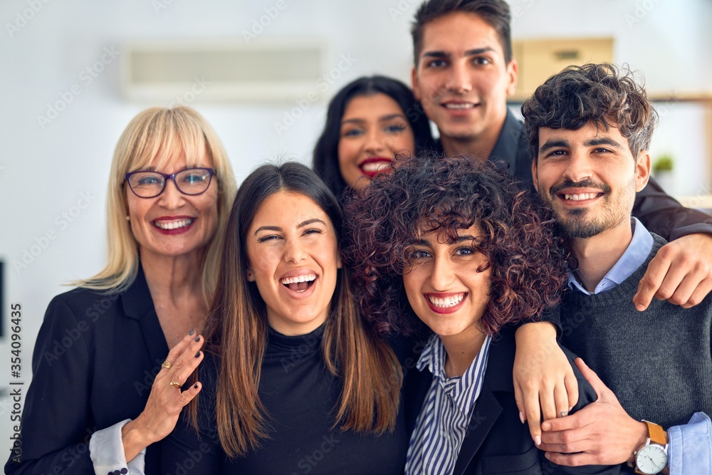 Group of business workers smiling happy and confident. Posing together with smile on face looking at the camera at the office Group of business workers smiling happy and confident. Posing together with smile on face looking at the camera at the office