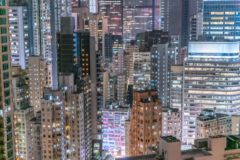 Naklejka premium The amazing night and sunset view of cityscape and skyscrapers in Hong-Kong