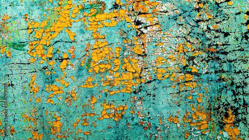 old yellow and blue cracked paint on the wall © Krzysztof Bubel
