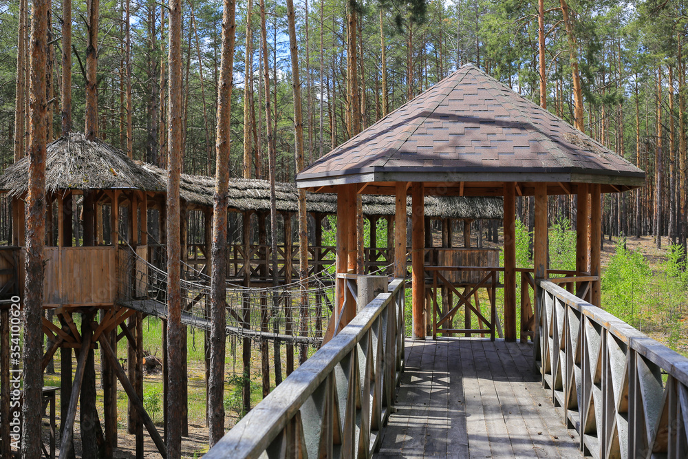 Old wooden bridge with arbor in the forest Old wooden bridge with arbor in the forest