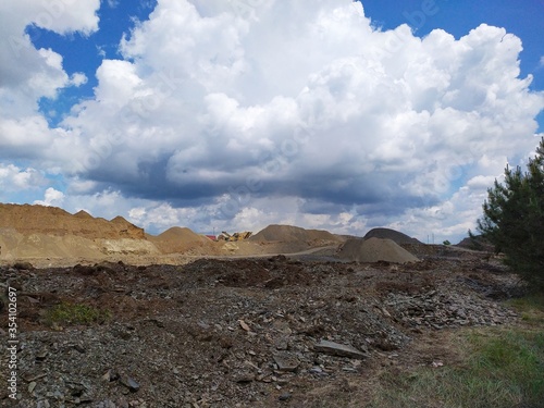 a large pile of sand and soil on the site of the quarry