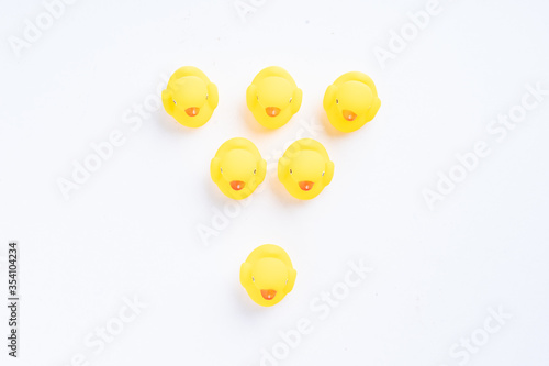 Leadership conceptual shot, a group of yellow rubber duck with one duck facing different direction