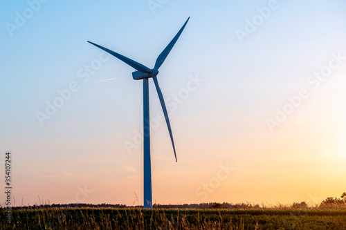 wind turbine at sunset photo