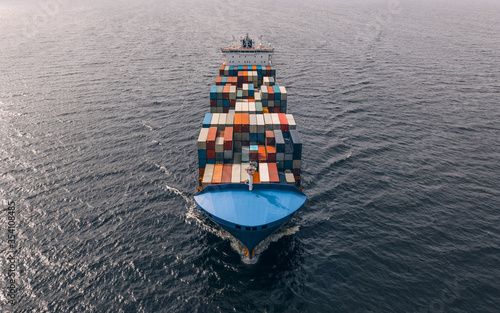 Container ship sailing in sea. High angled view