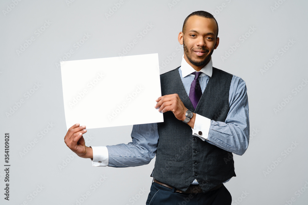 professional african-american business man - presenting holding blank sign professional african-american business man - presenting holding blank sign