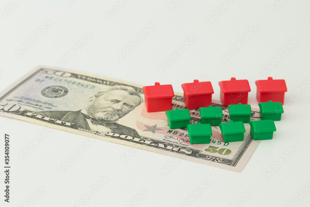 Naklejka premium Real estate and mortgage investment concept. Little houses on the white background.