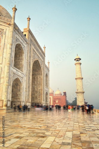 fragment of the Taj Mahal with people at dawn, India