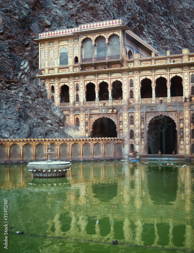 wall of the monkey temple in rock and green pond, Jaipur, India