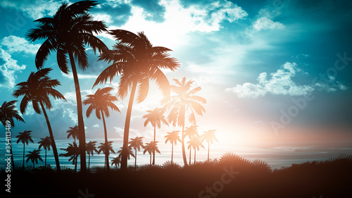 Fototapeta Naklejka Na Ścianę i Meble -  Tropical sunset with palm trees and sea. Silhouettes of palm trees on the beach against the sky with clouds. Reflection of palm trees on the water.