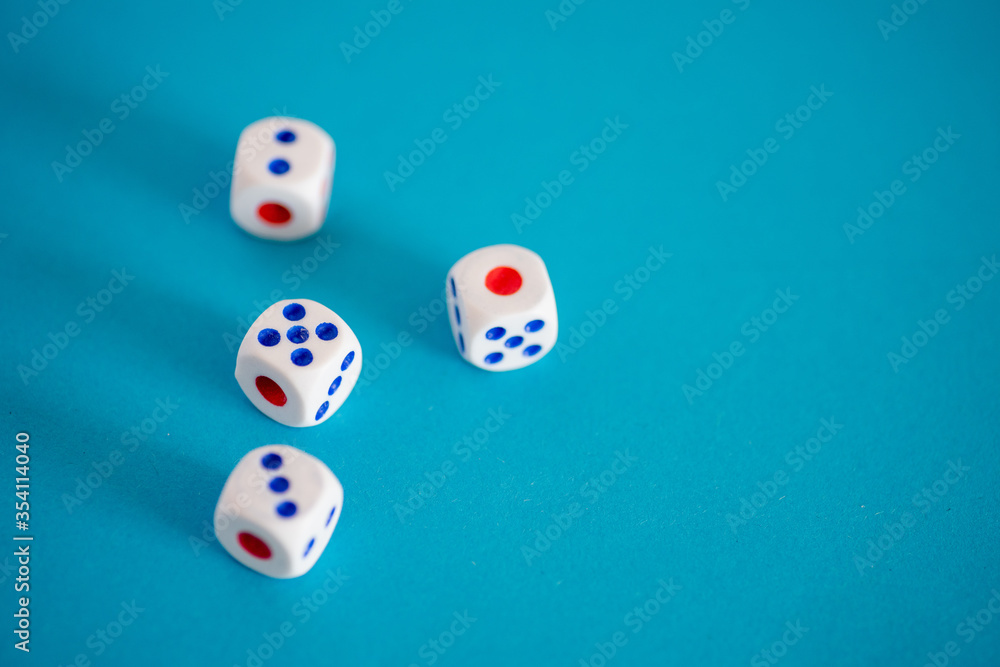Close up shot of dice against blue background Close up shot of dice against blue background