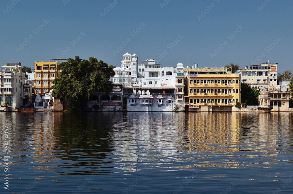 reflection of houses in the Udaipur river, India