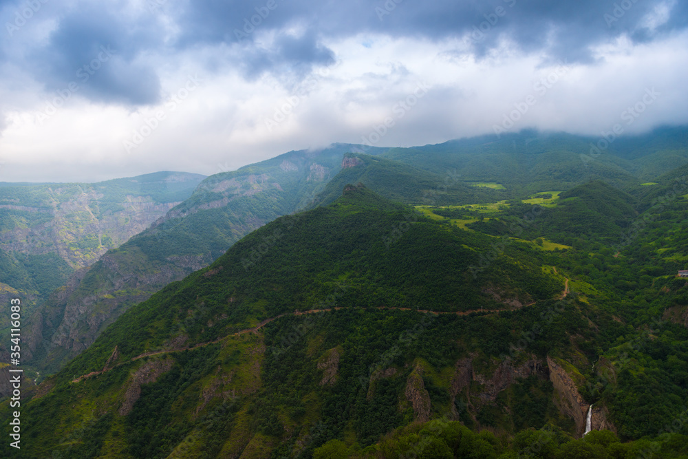 Beautiful clouds over the high and picturesque mountains of Armenia on a cloudy summer day