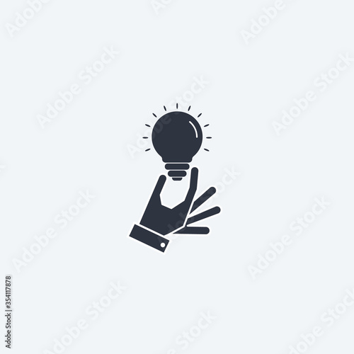 concept of idea. light bulb in hand. vector simple flat symbol