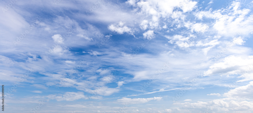 blue sky with white clouds and sun light background blue sky with white clouds and sun light background